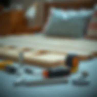Essential tools laid out for bed frame assembly, including a screwdriver and measuring tape